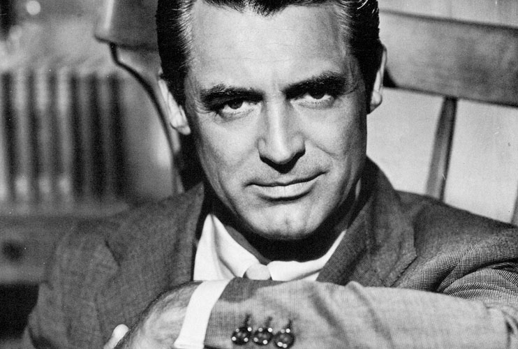 Black and white portrait of Cary Grant in a suit